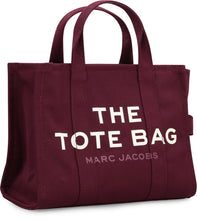 Load image into Gallery viewer, La traduzione di "The Canvas Medium Tote Bag" in italiano è "La borsa a tracolla in tela di media grandezza".
